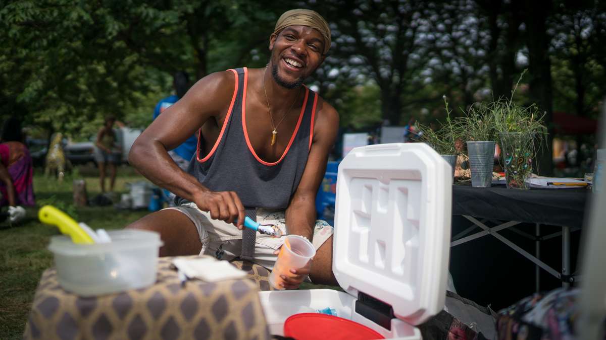 Henry Lee of Art Wear serves water-ice at the 4th annual Hoodstock Festival in North Philadelphia on July 22, 2017.