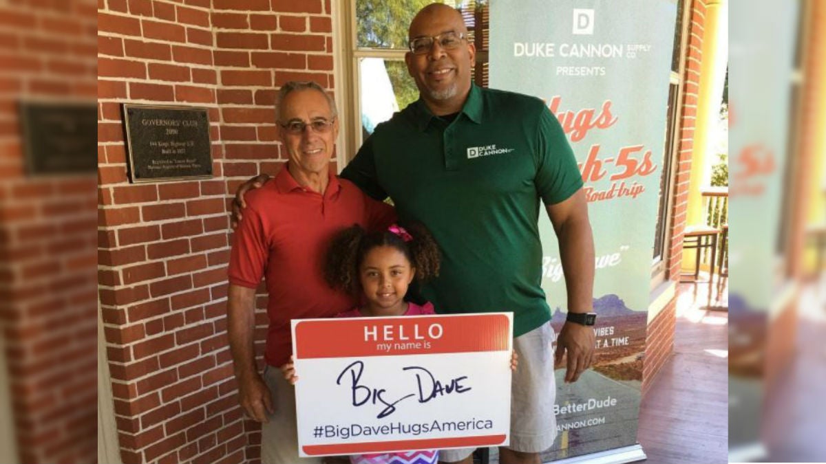  Dave Sylvester (right) poses with two high five recipients outside  the Governor's Cafe in Dover. (photo courtesy Dave Sylvester) 