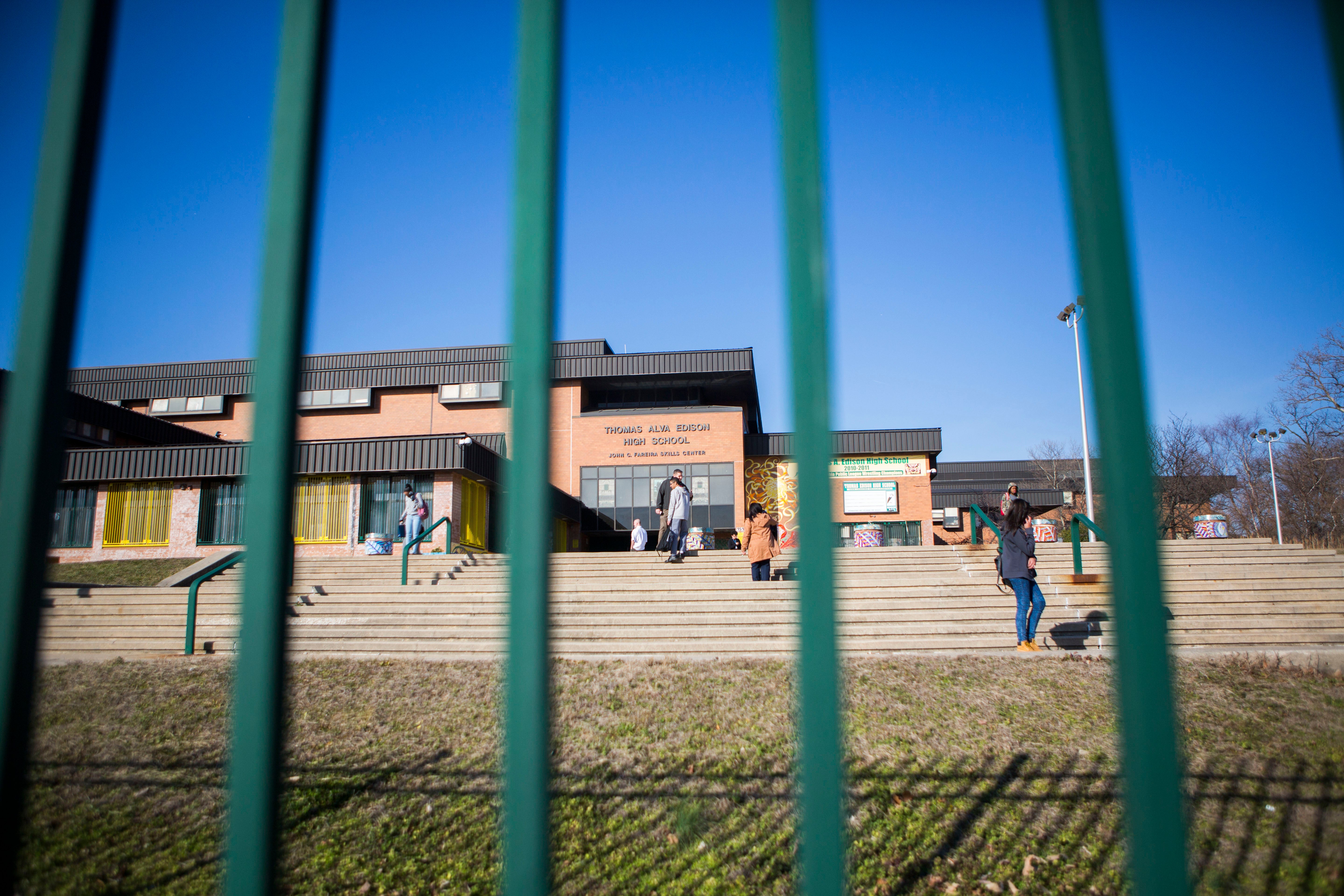 </b> Students at Thomas A. Edison High School in North Philadelphia linger on the steps at dismissal. (Jessica Kourkounis/For Keystone Crossroads)