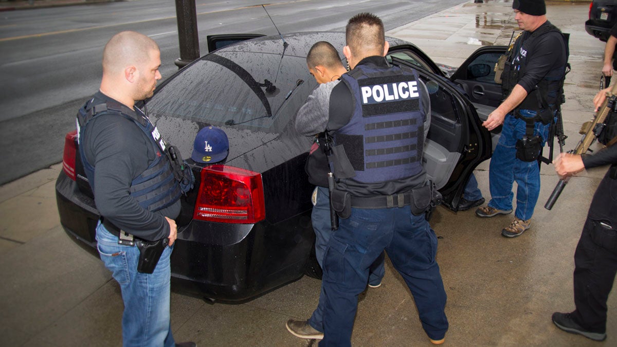  In this Tuesday, Feb. 7, 2017, photo released by U.S. Immigration and Customs Enforcement shows foreign nationals being arrested this week during a targeted enforcement operation conducted by U.S. Immigration and Customs Enforcement (ICE) aimed at immigration fugitives, re-entrants and at-large criminal aliens in Los Angeles.  (Charles Reed/U.S. Immigration and Customs Enforcement via AP) 