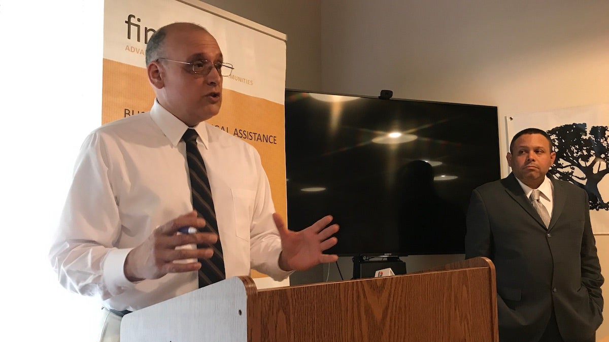  Will Gonzalez with the nonprofit community organization Ceiba introduces Programa Adelante at Finanta, another nonprofit organization, in North Philadelphia. (Laura Benshoff / WHYY) 