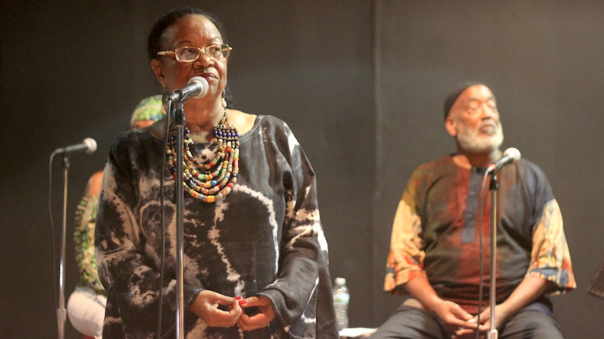  Caroliese Frink-Reed, left, tells the story of Joann Myers Brown, founder of Philadanco, at the New Freedom Theatre on Saturday. The storytelling event was part of PhilAesthetic, a series honoring the Black Arts Movement. (Emily Scott/WHYY) 