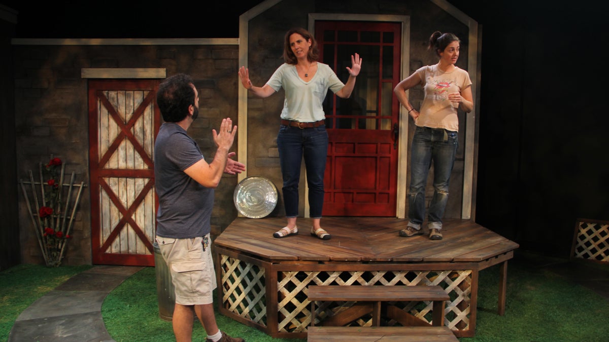  Director Mary Carpenter (center) prepares the Intimate Exchanges set for eight possible outcomes. (Emma Lee/WHYY) 