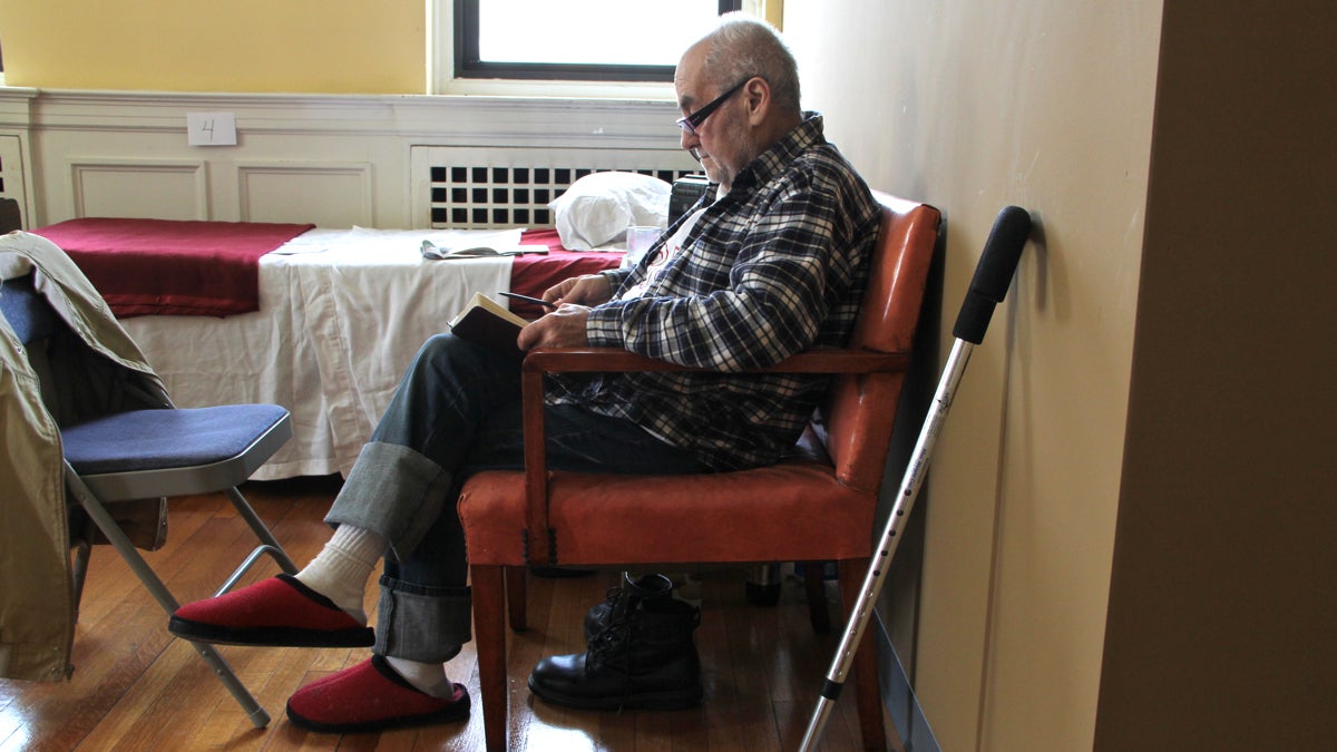  Frank Harper reads his Bible as he recuperates from a heart condition at the  Depaul House respite center in Germantown. (Emma Lee/ for NewsWorks) 