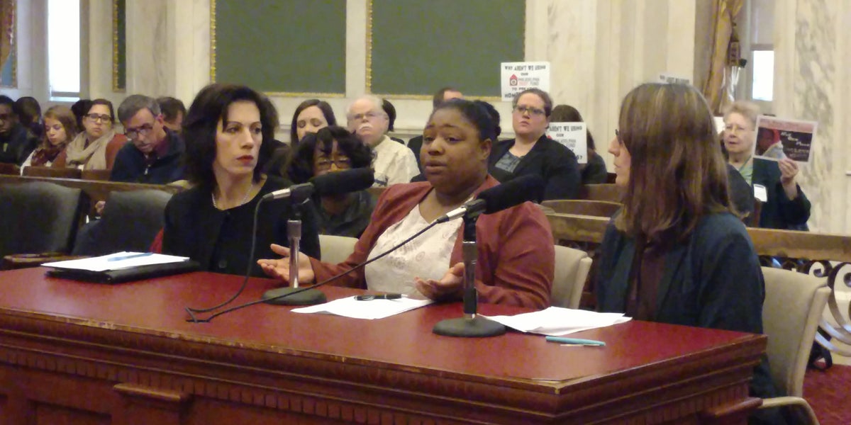  Nifia Medley (center) spoke Monday before Philadelphia City Council. She has been living in a homeless shelter with her 8-year-old daughter for 14 months.  (Katie Colaneri/WHYY) 