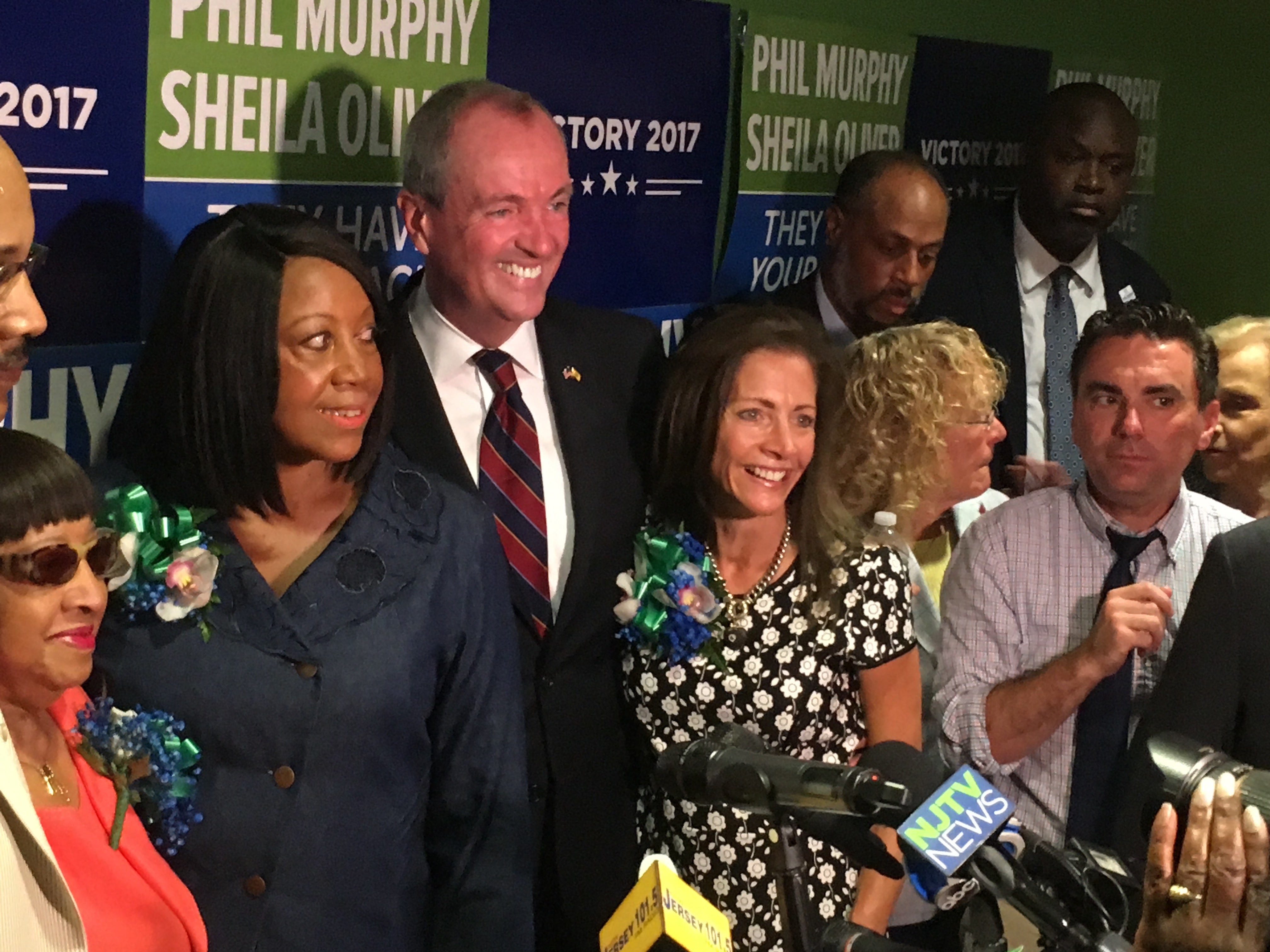  Sheila Oliver (left) stands next to Democratic gubernatorial nominee Phil Murphy (center) at Murphy's Newark headquarters (Ang Santos for NewsWorks) 