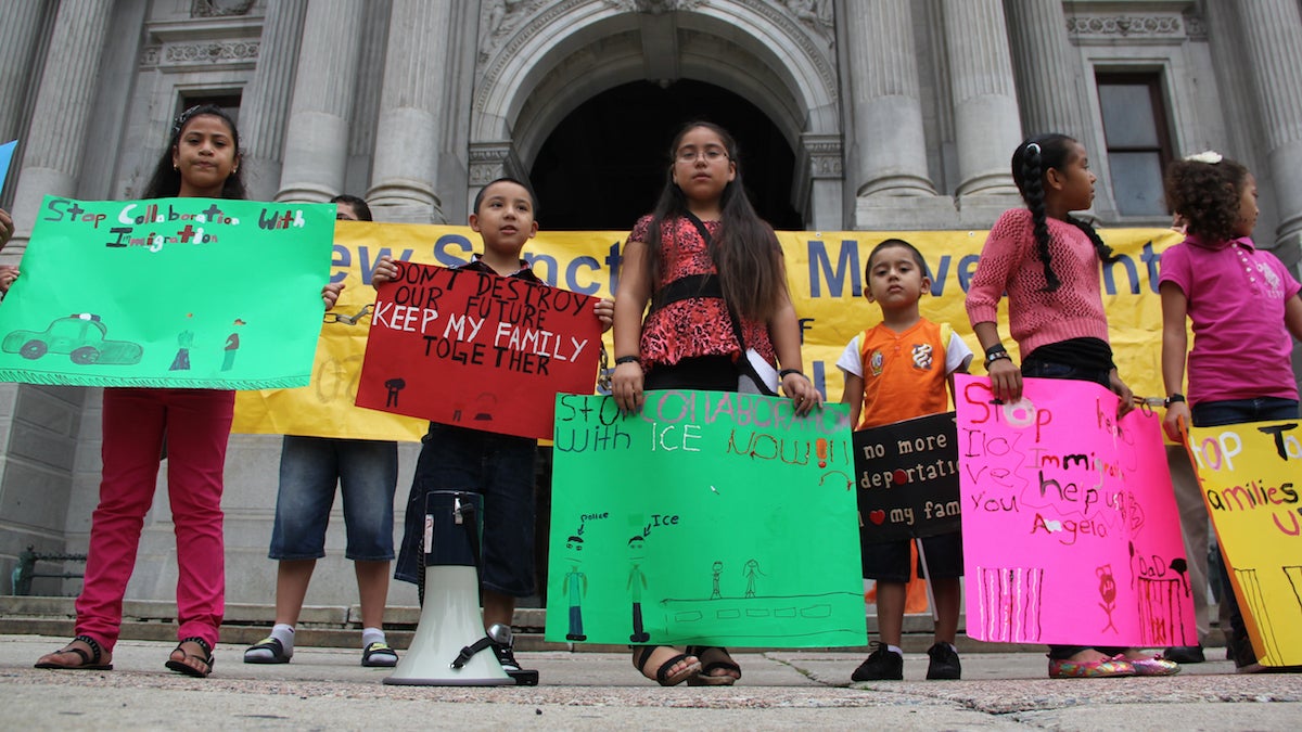 Children of immigrants stand in front of City Hall to protest city policies they say are tearing their families apart. (Emma Lee/for NewsWorks)