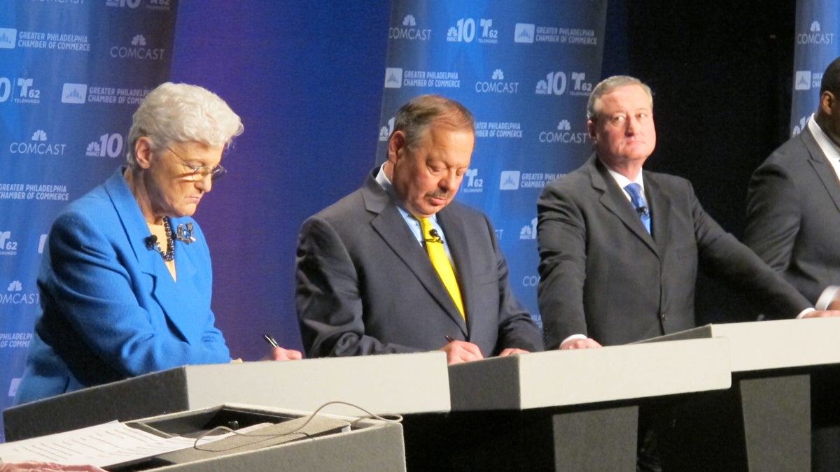  Mayoral candidate Lynne Abraham, flanked by rivals Nelson Diaz and Jim Kenney, takes notes Tuesday night during the debate. She later collapsed on the stage. (Katie Colaneri/WHYY) 