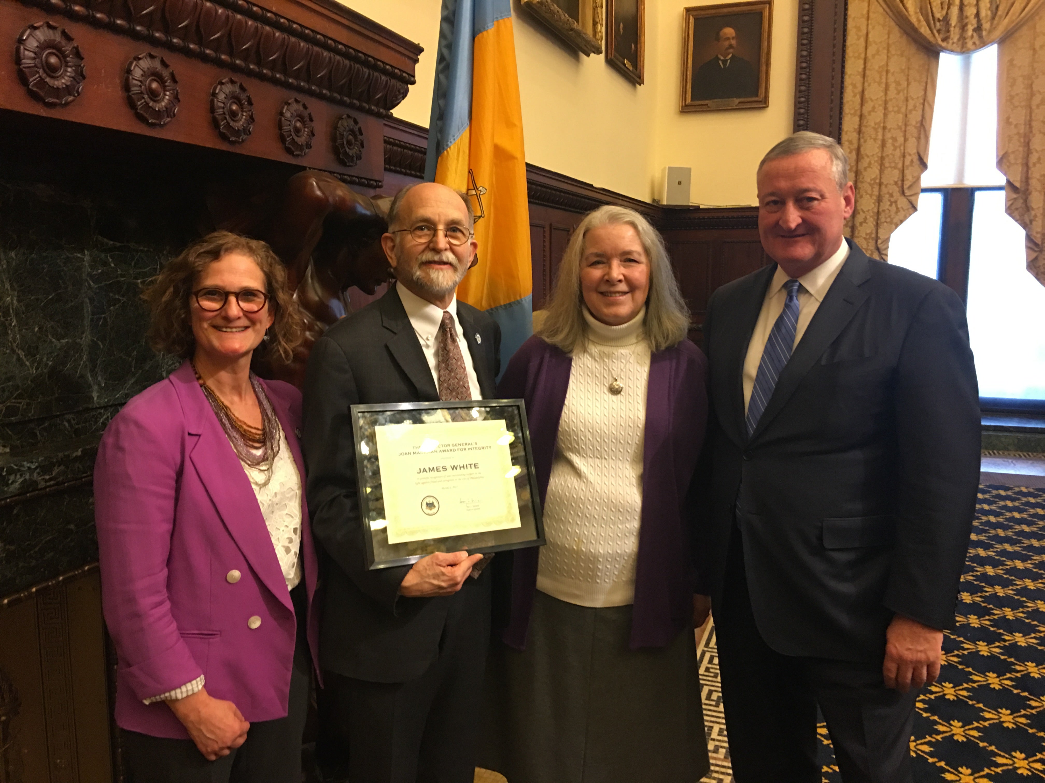 img_5468 Jim White (center) receives the 2017 Joan Markman Award for Integrity flanked by his wife, Clare Bohn, Mayor Jim Kenney and Inspector General Amy Kurland (left). (Tom MacDonald/WHYY)
