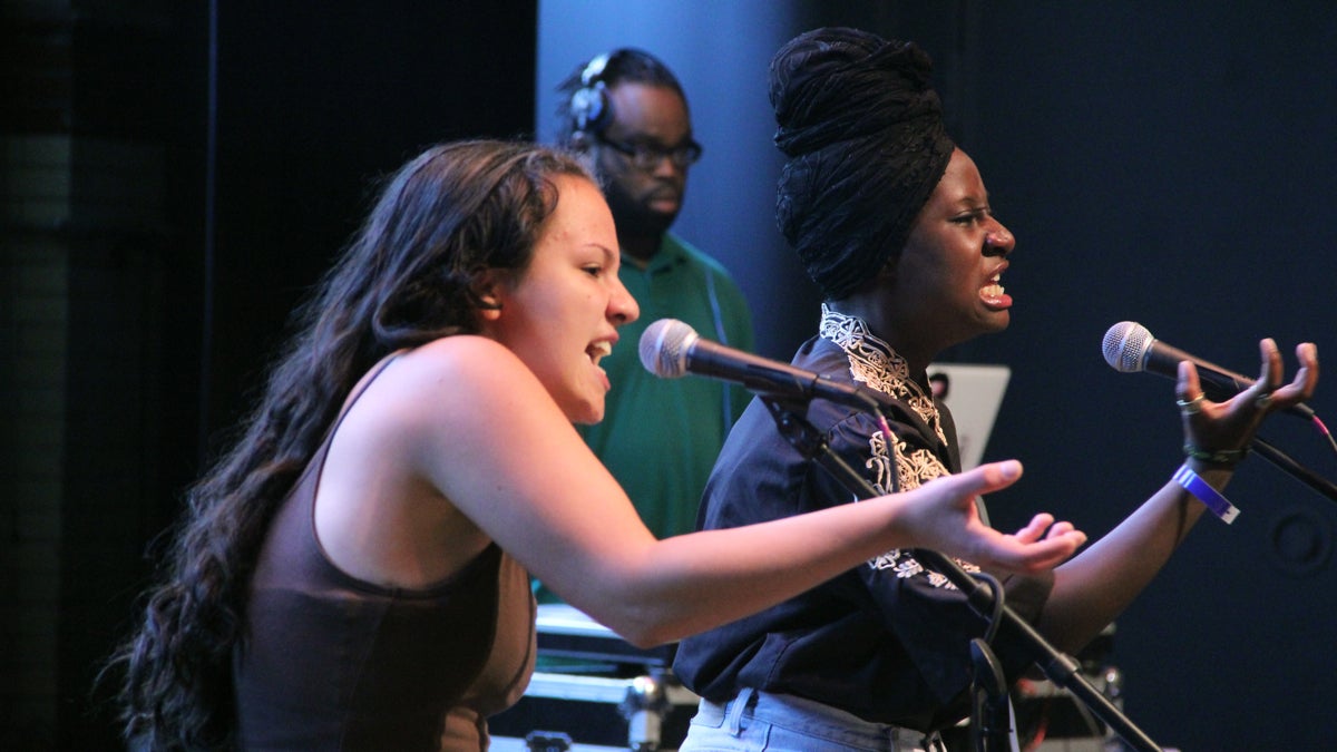 Sabrina Slipchenko (left) and Ainy'e Clark of Team Philadelphia perform at the Brave New Voices poetry slam. (Emma Lee/WHYY)