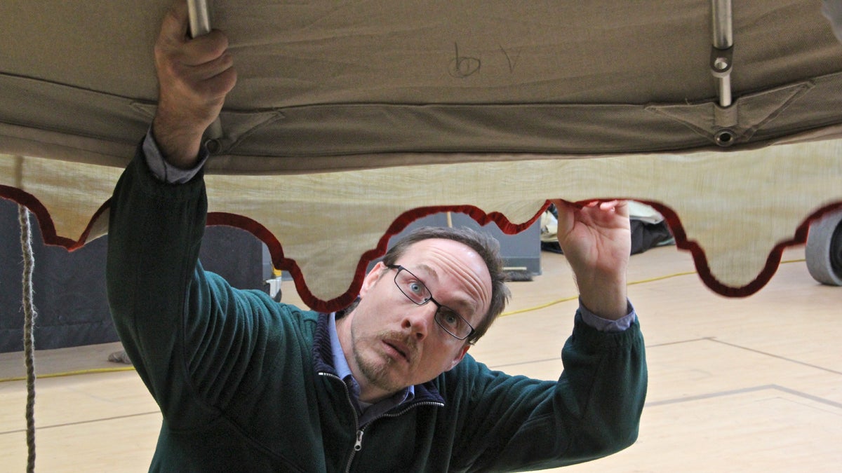  John Davis of Keast and Hood Engineers extends the framework that will protect George Washington's command tent when is is displayed at the Museum of the American Revolution. (Emma Lee/for NewsWorks) 