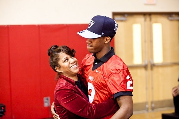 <p><p>Najee Goode and his mother Felicia embrace on National Signing Day. (Brad Larrison/for NewsWorks)</p></p>
