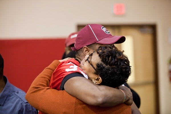 <p><p>David Williams hugs his mother Tamara after signing with the University of South Carolina on Wednesday morning. (Brad Larrison/for NewsWorks)</p></p>
