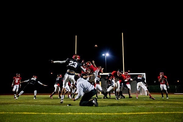 <p><p>Tuesday's practice ended with special-teams drills. At Lonnie Young, a baseball backstop is used to represent the goalposts which Johnston Memorial Stadium has. (Brad Larrison/for NewsWorks)</p></p>
