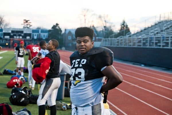 <p><p>An offensive lineman suits up before a crisp practice commences. (Brad Larrison/for NewsWorks)</p></p>
