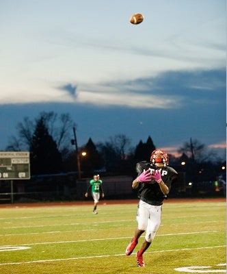 <p><p>An Imhotep wide receiver attempts an over-the-shoulder reception. (Brad Larrison/for NewsWorks)</p></p>

