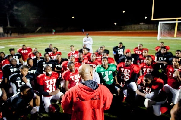 <p><p>Imhotep Institute Charter High School football head coach Albie Crosby addresses the team as they prepare to host a state semifinal game this weekend in Germantown. (Brad Larrison/for NewsWorks)</p></p>
