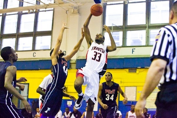 Imhotep's Jalil Myers goes to the hoop. (Brad Larrison/for NewsWorks)
