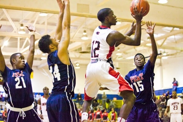 Imhotep's Jakwan Jones tries to put two more on the board. (Brad Larrison/for NewsWorks)
