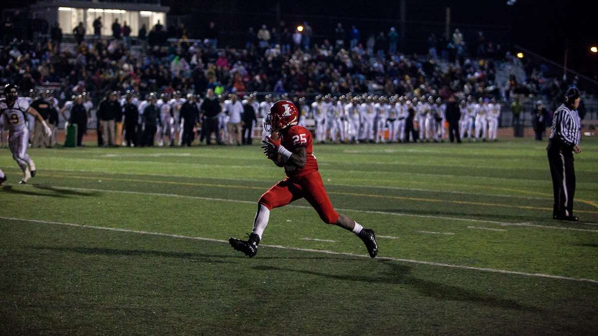 Imhotep running back Mike Waters glides into the endzone in Imhotep's first possesion of the second half. (Brad Larrison/for NewsWorks)