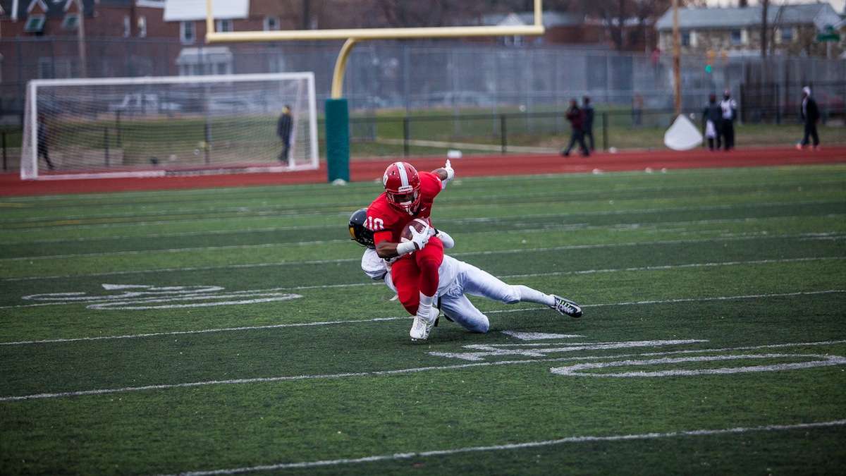 Imhotep senior Khalif Clemons is brought down after a short pass in the first quarter. (Brad Larrison/for NewsWorks)