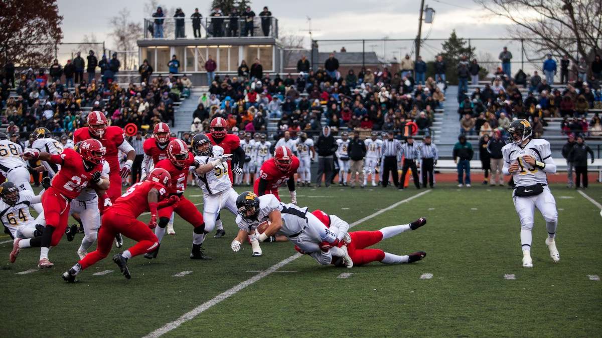 Alex Arcangeli is brought down by the Imhotep defense during Wood's second drive. (Brad Larrison/for NewsWorks)