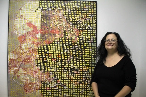 <p><p>Featured artist Susan Mangan stands beside her piece "Tide" at the Imperfect Gallery show last weekend. (Trenae V. McDuffie/for NewsWorks)</p></p>

