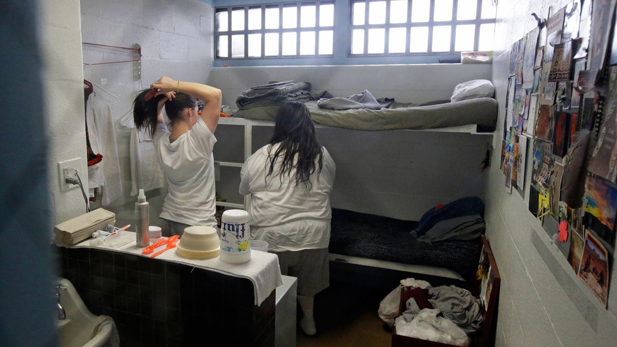 Female inmates interact in their cell in this file photo. (Rick Bowmer/AP Photo, Pool)