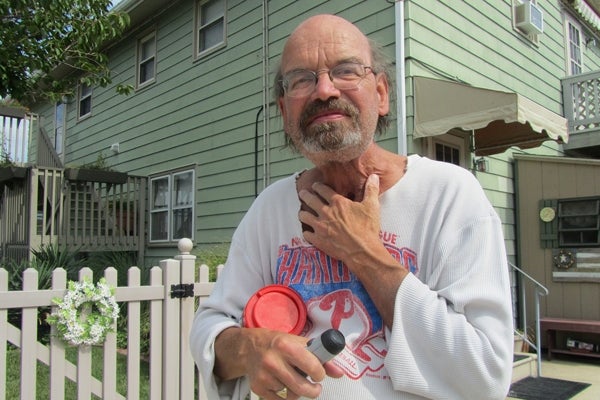 Barry Sharp in front of his home in Wildwood Crest. He has been a resident for 50 years and plans to ride out the storm. (Kimberly Paynter/For NewsWorks)