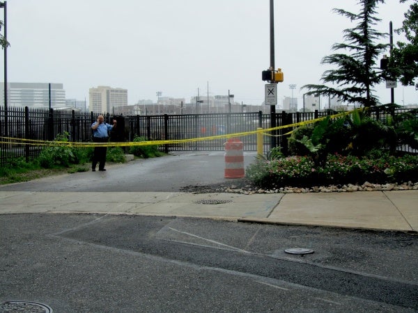 The Schuylkill River path is taped off and guarded. (Kimberly Paynter/For NewsWorks)