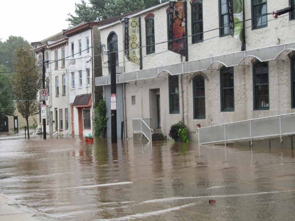 ﻿﻿Manayunk residents saw flooding early Sunday along Main Street. (Megan Pinto/For NewsWorks)