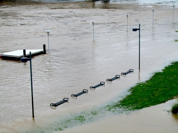 Benches and light posts partially submerged around the Schuylkill River Path. (Kimberly Paynter/For NewsWorks)