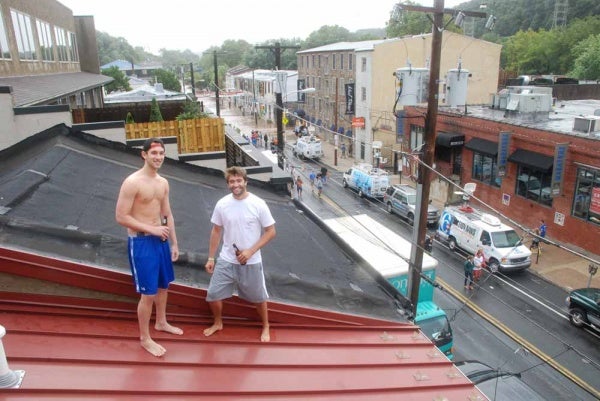From their roof, college students Joe Schurr and Kerry Gallagher enjoy their 