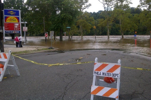Flood waters creeped up towards a gas station in northwest Philadelphia Sunday. (Brian Hickey/For NewsWorks)