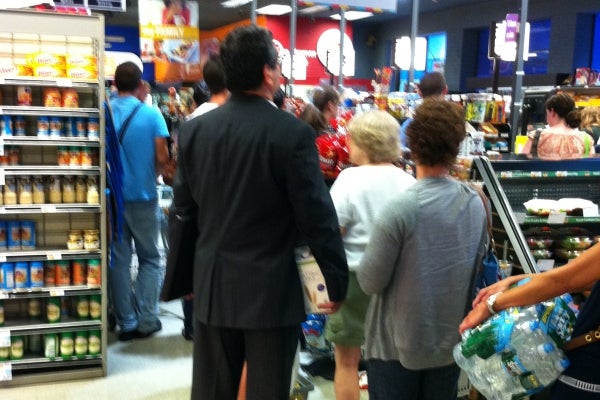 Shoppers Friday had to wait in long lines at one Philadelphia market as many stocked up on supplies for Hurricane Irene.