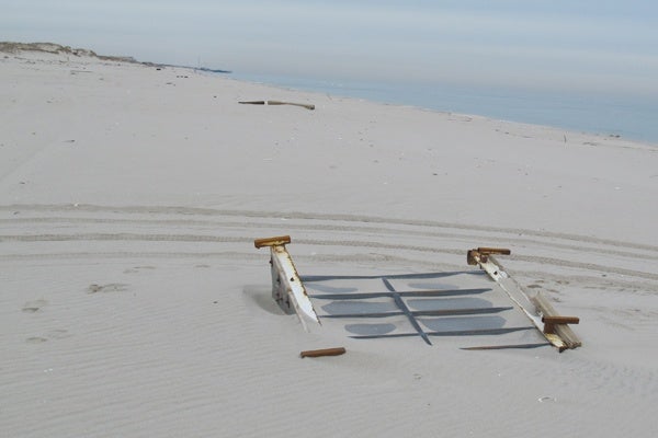 <p><p>One of the cars from the destroyed roller coaster in Seaside Heights is buried in the sand at Island Beach State Park. (Phil Gregory/for NewsWorks)</p></p>
