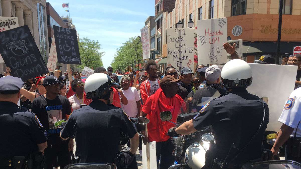 Protesters confront police on Market St. in downtown Wilmington after police shot Jeremy McDole to death in September, 2015. (John Jankowski for WHYY)