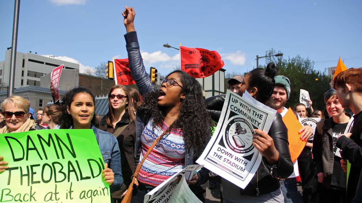 Temple University students block Broad Street at Cecil B. Moore Avenue to protest the proposed building of a new football stadium. (Emma Lee/WHYY)