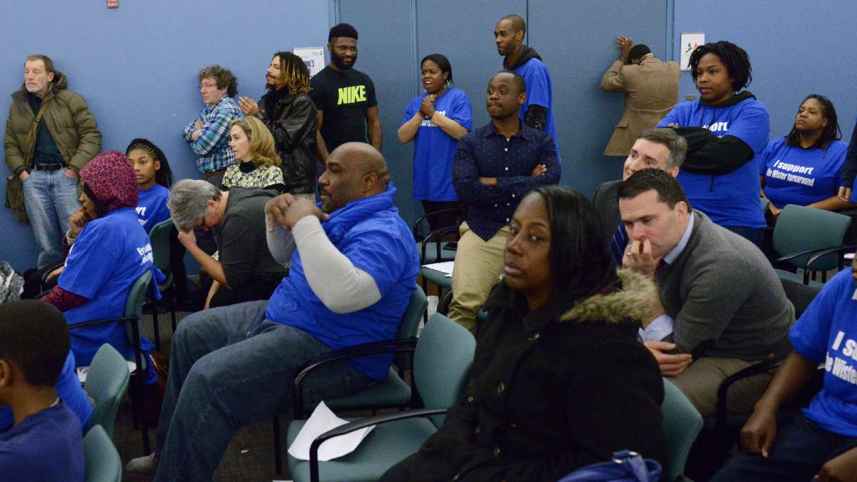 Advocates for and against conversion await a vote on the surprise resolution to begin the conversion process at East Germantown's Wister Elementary school. (Bastiaan Slabbers for WHYY)