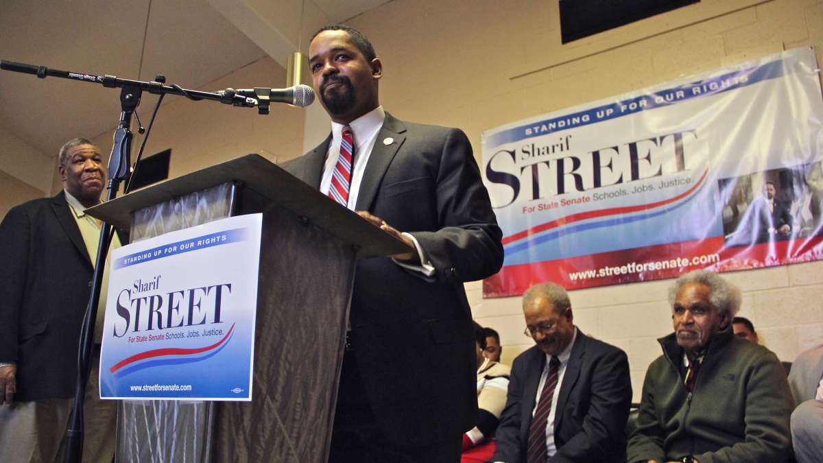 Sharif Street launches his campaign for state Senate in 2017. Behind him are (from right) his father, former Philadelphia Mayor John Street and former U.S. Rep. Chaka Fattah. (Emma Lee/WHYY)
