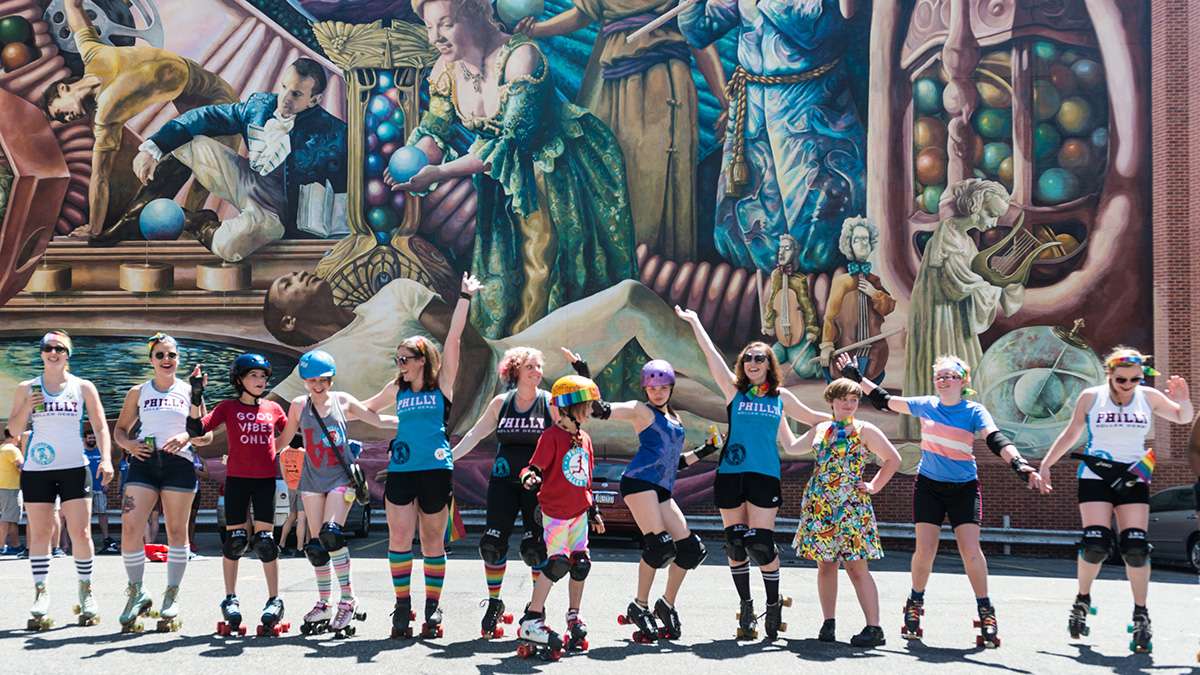 Members of Philly Roller Derby practice a dance routine at the start of Philadelphia Pride Parade and Festival in 2017. (Branden Eastwood for WHYY)

