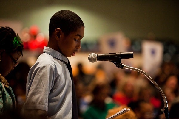 <p><p>McCloskey Elementary sixth-grader Lacroixx Brice reads a speech he wrote about why his school shouldn't be closed, citing academic acheivement among many students. (Brad Larrison/for NewsWorks)</p></p>
