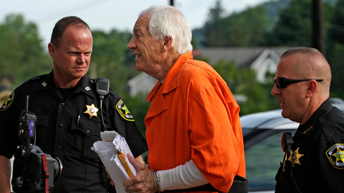 In this file photo, former Penn State University assistant football coach Jerry Sandusky, center, arrives at the Centre County Courthouse, in Bellefonte, Pa. Friday, Aug. 12, 2016. (Gene J. Puskar/AP Photo, file) 