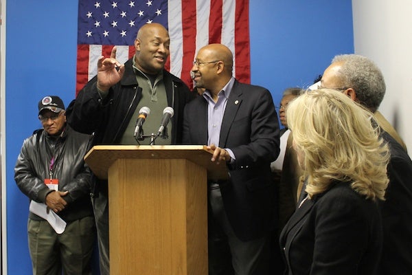 <p><p>State Rep. Dwight Evans and Mayor Michael Nutter share a moment at the podium at Saturday afternoon's rally. (Matthew Grady/for NewsWorks)</p></p>
