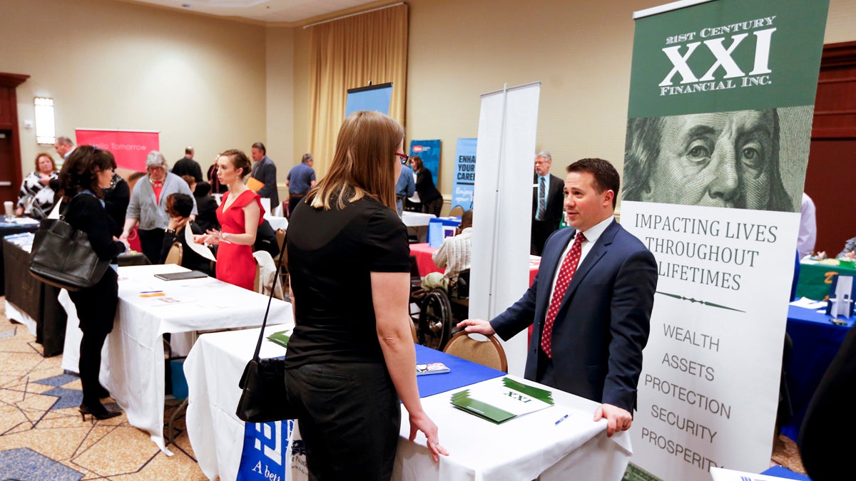 Employment recruiters and company representatives speak with job seekers at a job fair in Pittsburgh. (AP Photo/Keith Srakocic)