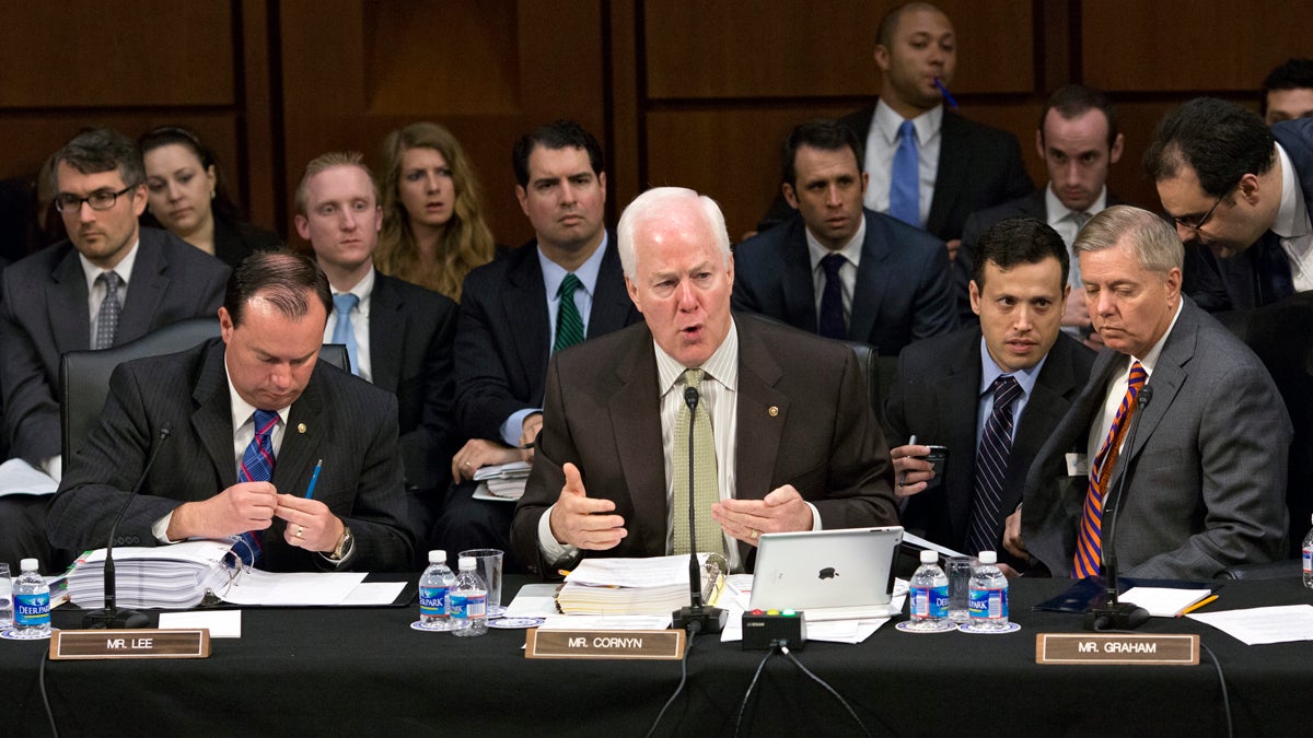  Senate Judiciary Committee members, Sen. Mike Lee, R-Utah, Sen. John Cornyn, R-Texas, and Sen. Lindsey Graham, R-S.C., discuss proposed changes to immigration reform. The bill creates a 13-year pathway to citizenship for an estimated 11.5 million immigrants currently in the United States illegally. Internal divisions within the Republican party, disagreements over policy, cost concerns and more add complexity. (AP Photo/J. Scott Applewhite, File) 