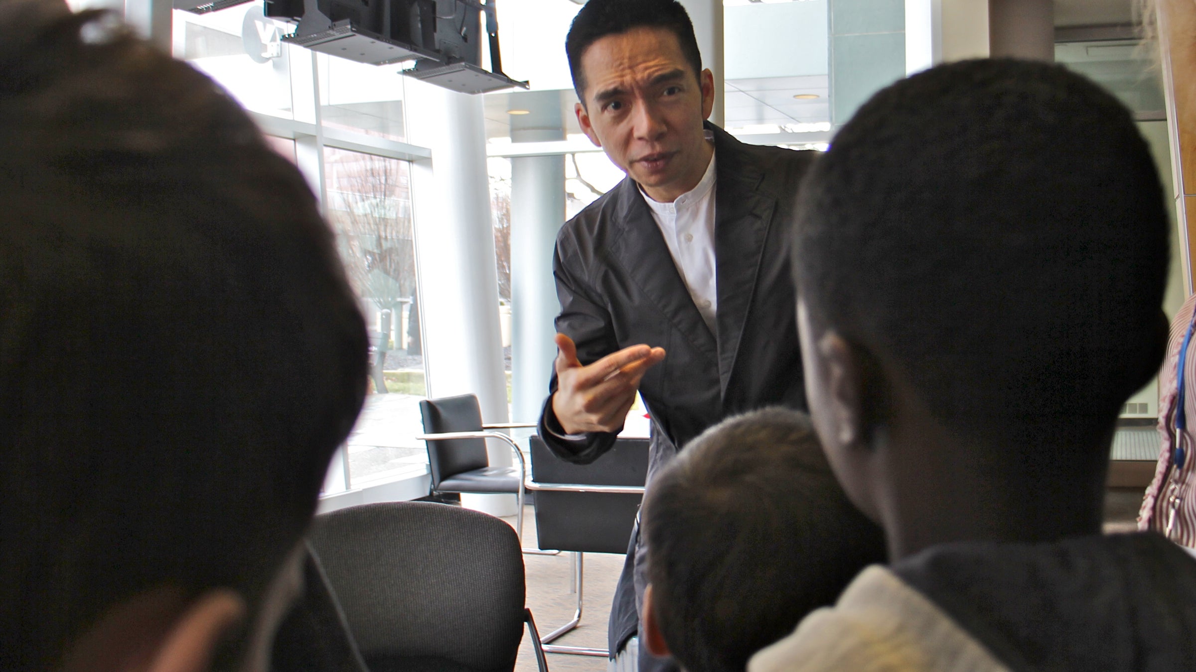  John Maeda, the global head of computational design and inclusion at web developer Automattic, speaks with a school group at WHYY studios. (Emma Lee/WHYY) 