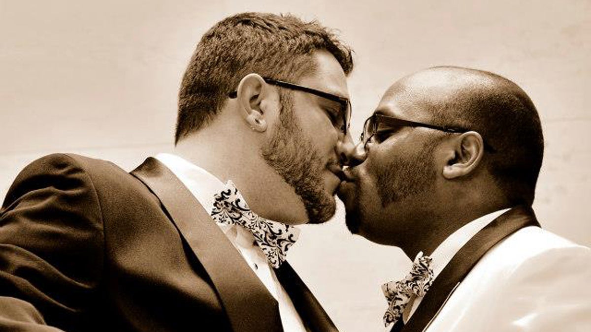 From left: John and Tommy Fisher-Klein share a kiss on their wedding day. (Image courtesy of John Fisher-Klein) 