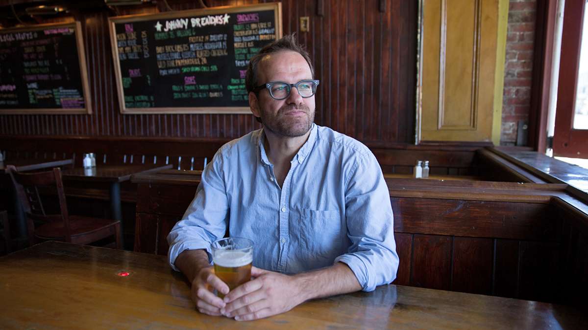 Ten years ago, William Reed (pictured) and Paul Kimport walked into a corner bar in Fishtown and walked out with a handshake agreement to buy what has become one of Philly's iconic bars, Johnny Brenda's. (Lindsay Lazarski/WHYY)