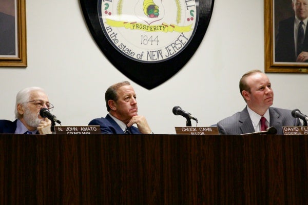 <p>Cherry Hill's Mayor Chuck Cahn, Council President David Fleisher and Councilman N. John Amato listen to public remarks on the township's new smoking ban. ( Jana Shea /for NewsWorks )</p>
